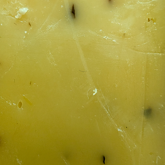 Baby Gouda Truffle cheese texture close-up