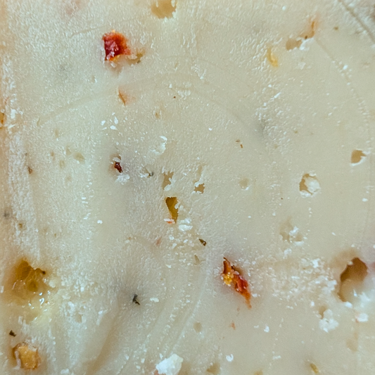 Dutch Goat Italian Herbs cheese texture close-up