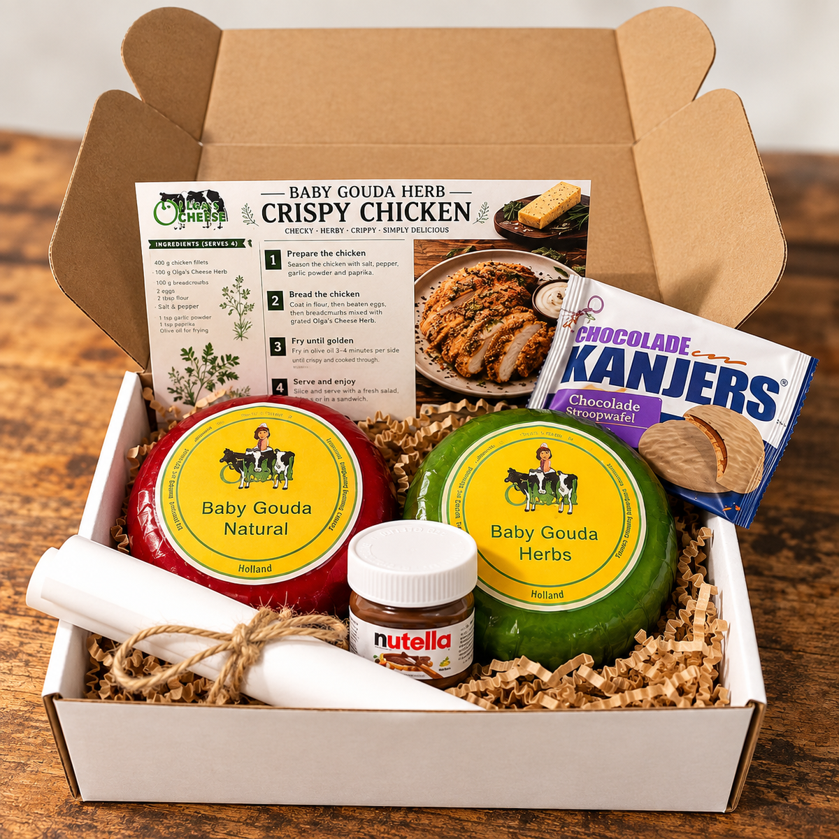 Olga's Monthly Mystery Cheese Box with two Baby Gouda cheeses and Dutch treats
